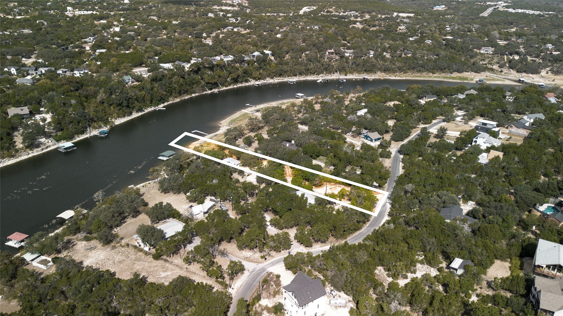 11104 Beach Road Leander, TX 78641 - Photo 2 of 21 Aerial view of property and surrounding area with a nearby body of water and property parcel outlined