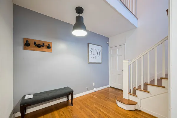 a view of room with stairs and a rug