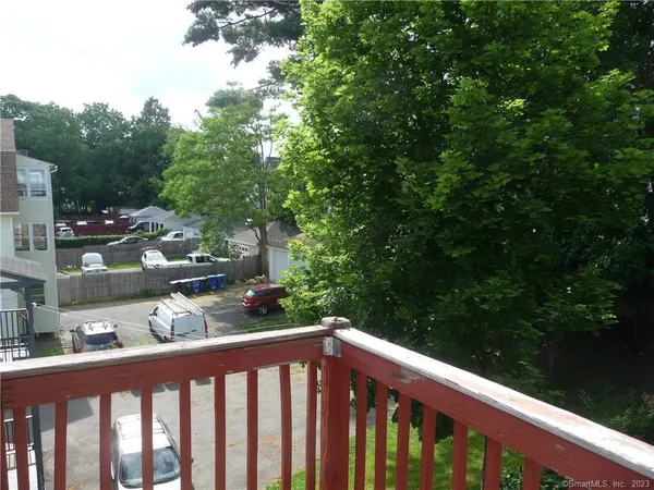 a view of a car parked in front of a house
