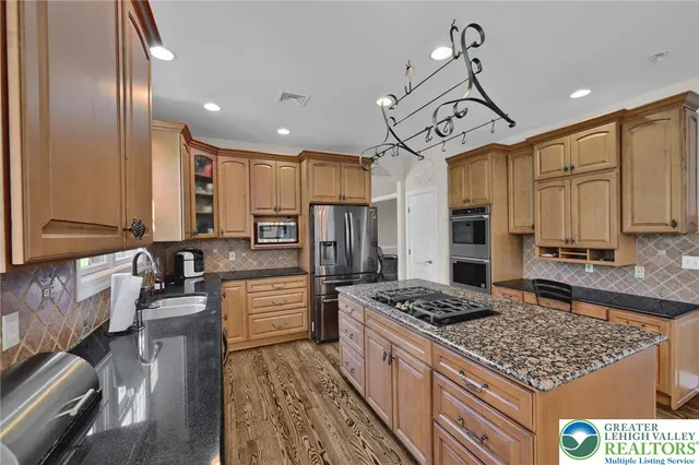 a view of a livingroom with furniture and a flat screen tv