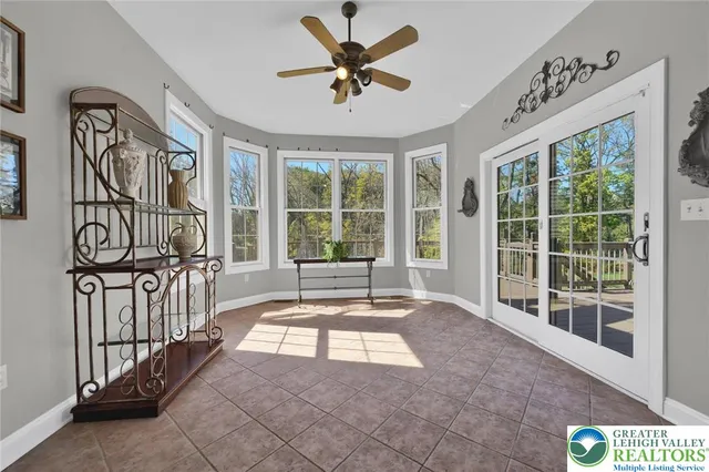a white toilet sitting next to a small bathroom
