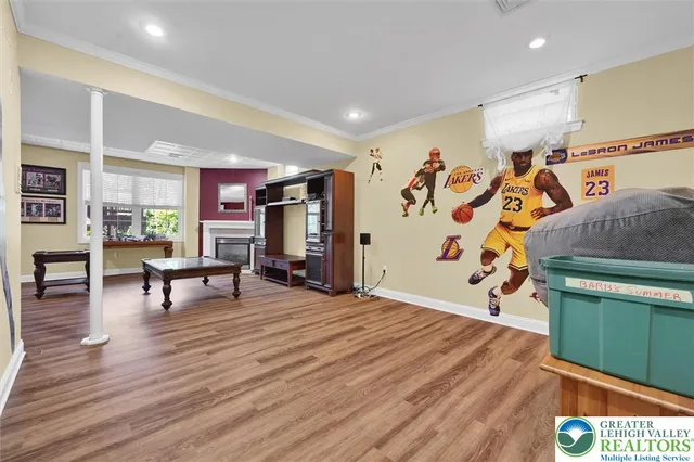 a spacious bedroom with a bed and wooden floor