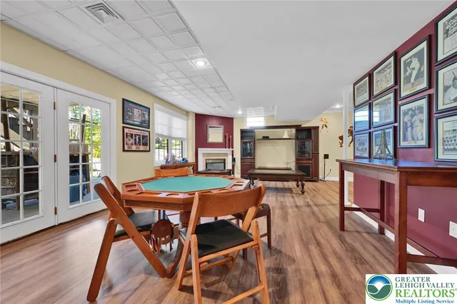 a bathroom with a double vanity sink mirror and bathtub