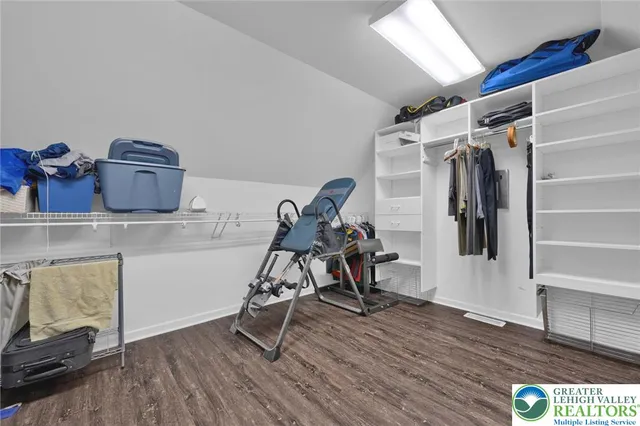 a view of a big room with a big yard and large trees