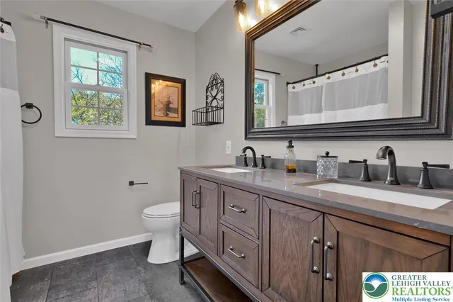 a view of a house with a yard and garage