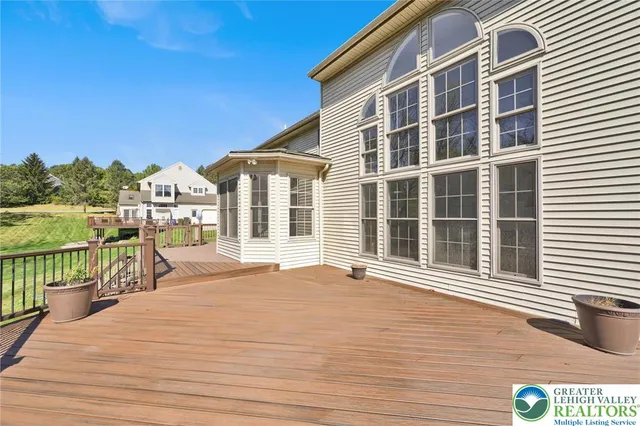 an aerial view of a house with yard swimming pool and outdoor seating