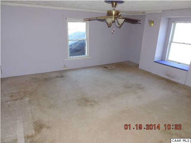 669 Lawyers Road Red House, VA 23963 - Photo 16 of 24 an empty room with windows and fan