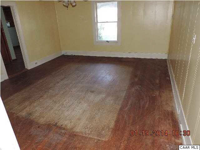669 Lawyers Road Red House, VA 23963 - Photo 6 of 24 an empty room with wooden floor and windows