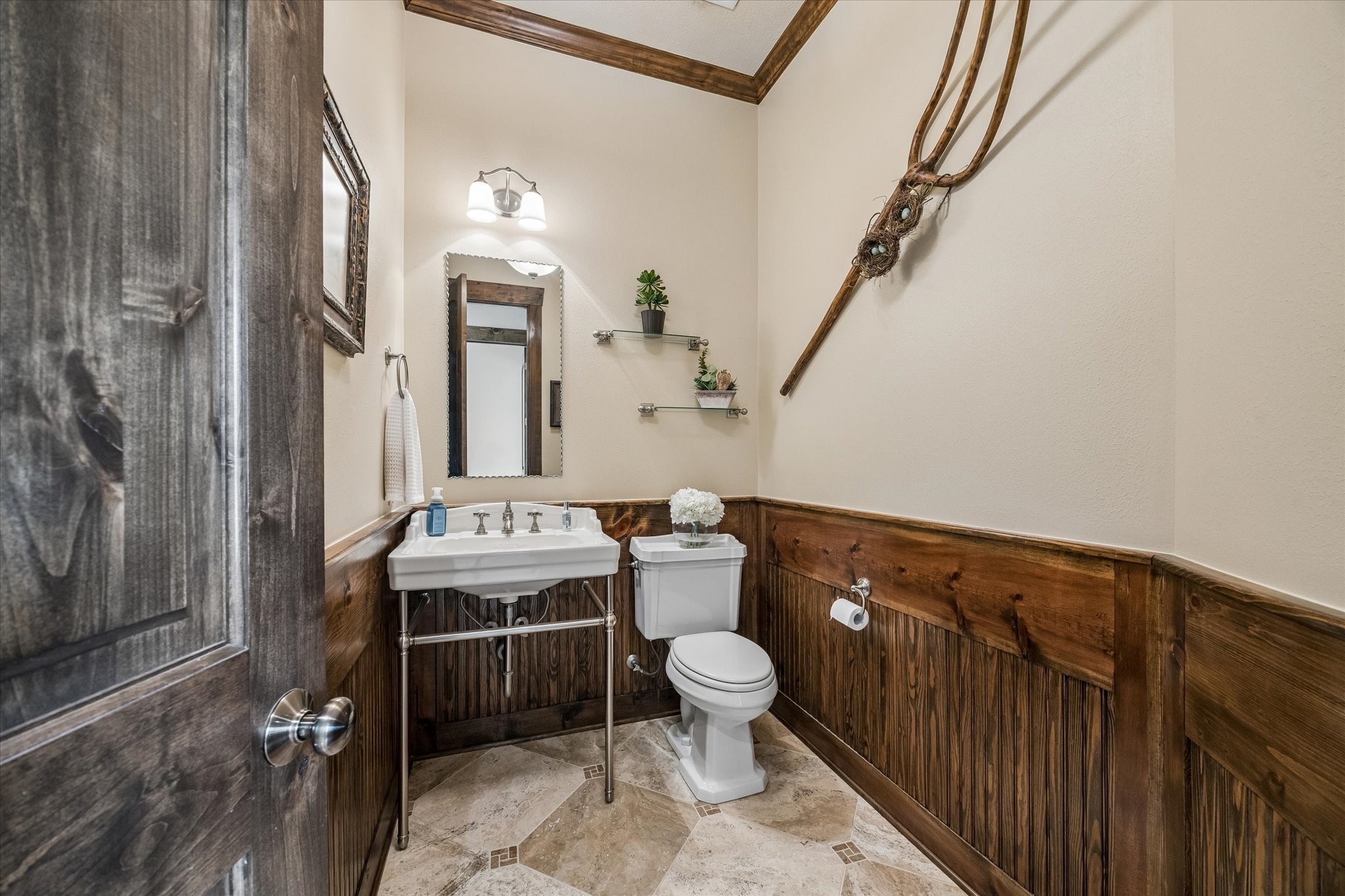 32102 Fulbrook Commons Fulshear, TX 77441 - Photo 28 of 50 Conveniently located for guests, this charming powder room showcases warm wood accents and finishes that complement the home's custom character.