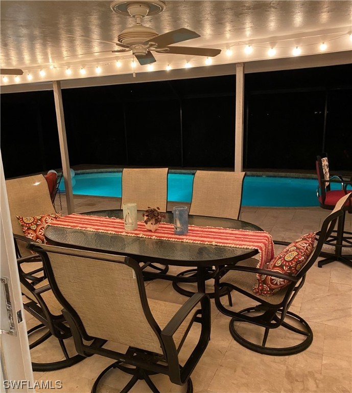 1113 Sand Castle Road Sanibel, FL 33957 - Photo 11 of 50 a view of a dining room with furniture and window