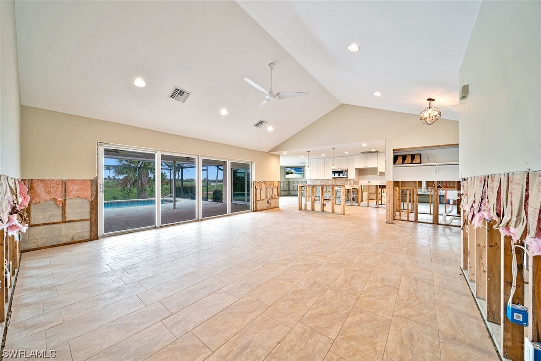 1113 Sand Castle Road Sanibel, FL 33957 - Photo 18 of 50 a big room with lots of furniture and a large window