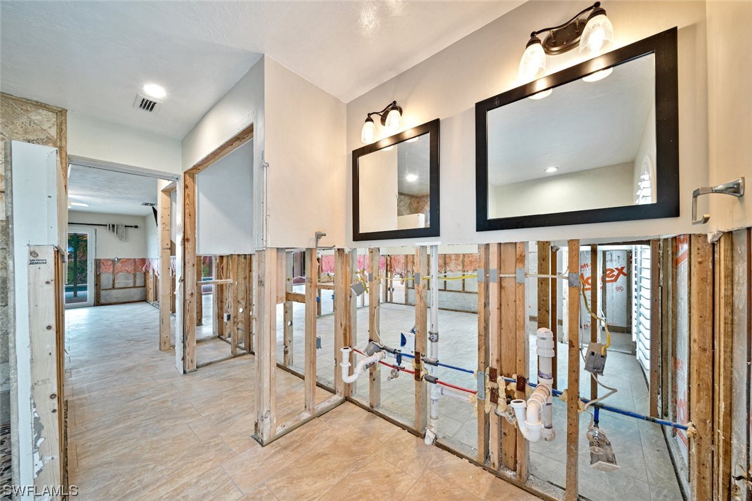 1113 Sand Castle Road Sanibel, FL 33957 - Photo 33 of 50 a view of hallway with wooden floor