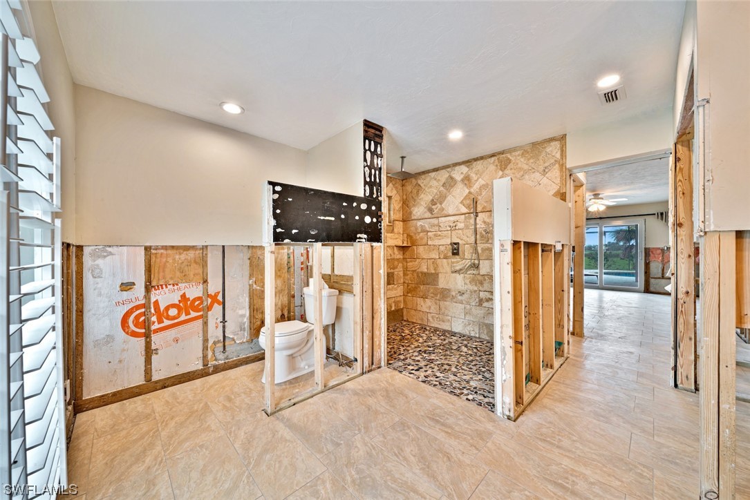 1113 Sand Castle Road Sanibel, FL 33957 - Photo 35 of 50 a spacious bathroom with a shower and a sink