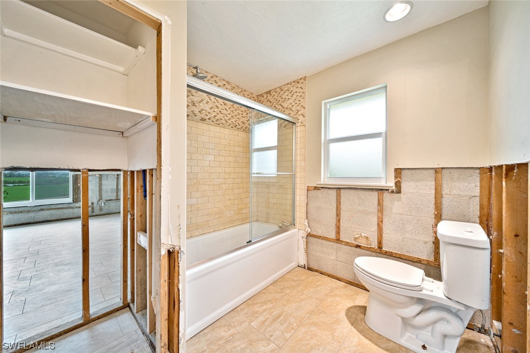 1113 Sand Castle Road Sanibel, FL 33957 - Photo 40 of 50 a bathroom with a toilet sink tub and view