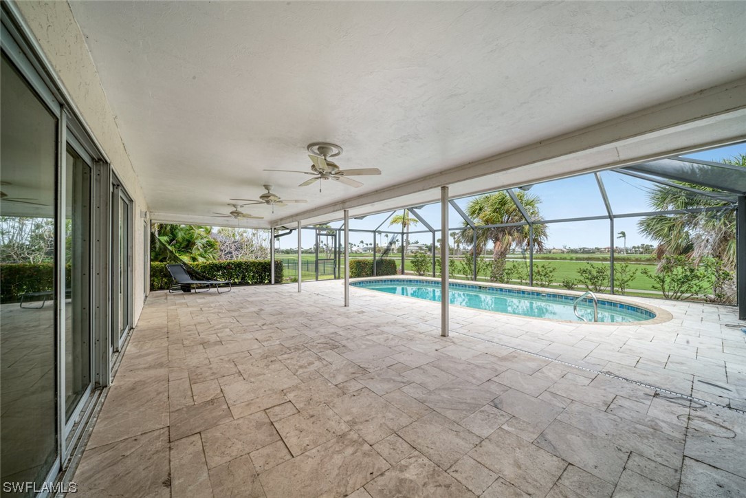 1113 Sand Castle Road Sanibel, FL 33957 - Photo 44 of 50 a view of a house with porch and a yard