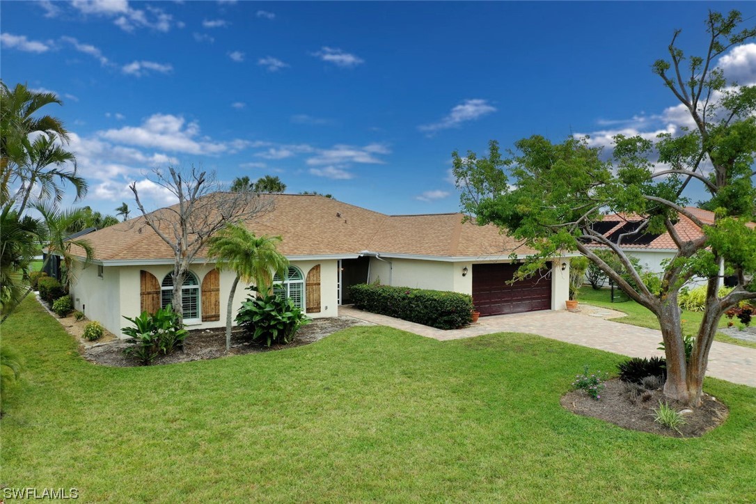 1113 Sand Castle Road Sanibel, FL 33957 - Photo 48 of 50 a view of a yard in front of house