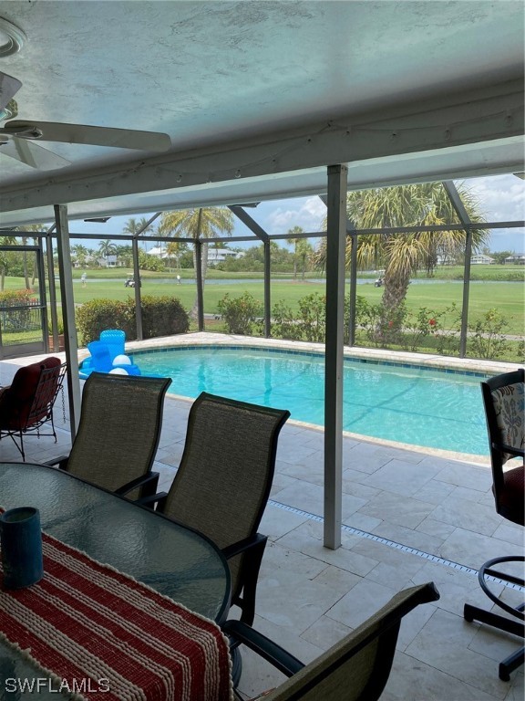 1113 Sand Castle Road Sanibel, FL 33957 - Photo 10 of 50 a living room with chairs and a table