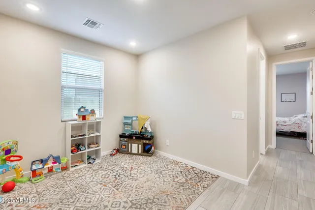 a view of a workspace with furniture and toys