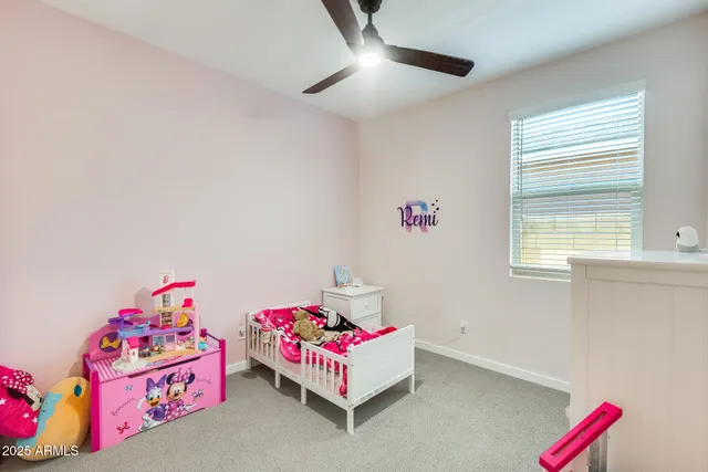 a bedroom with furniture and a chandelier