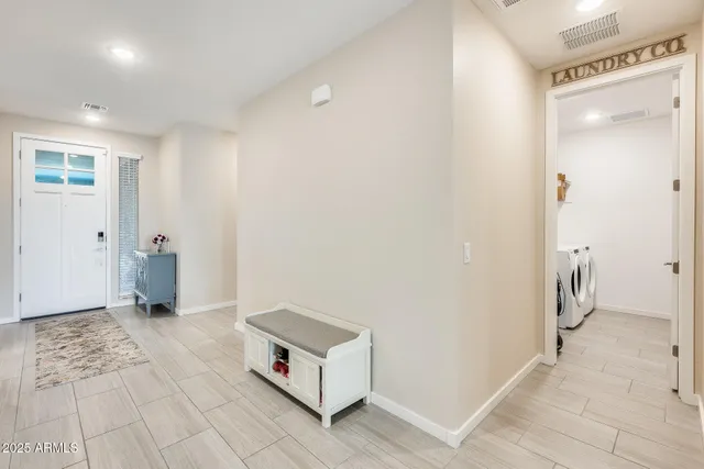 a room with a table and a rug