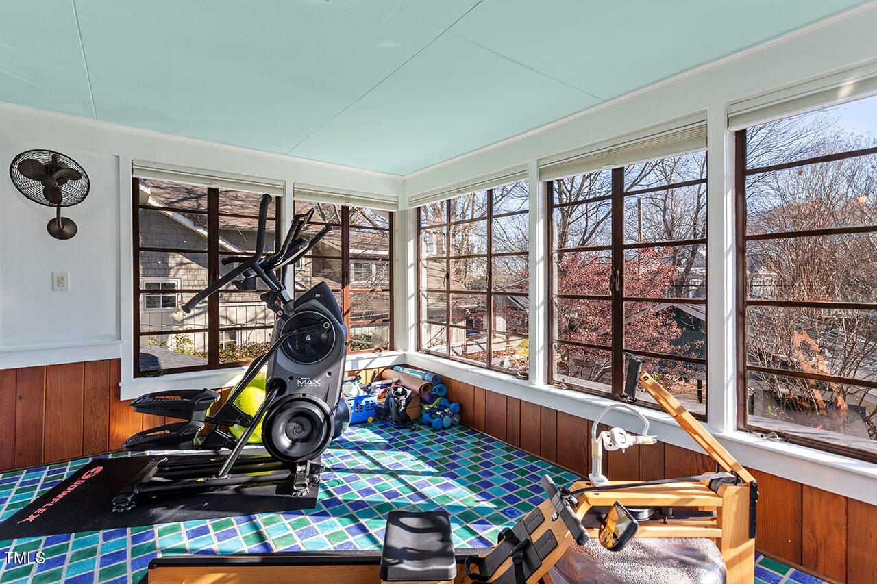 210 Woodburn Road Raleigh, NC 27605 - Photo 26 of 54 a room with gym equipment and a large window