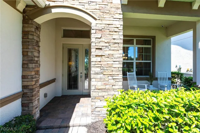 a view of a door of the house with a fountain