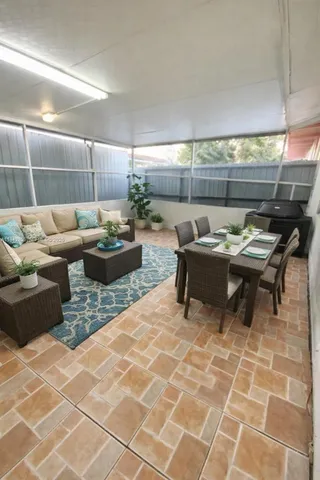 a living room with furniture and a table