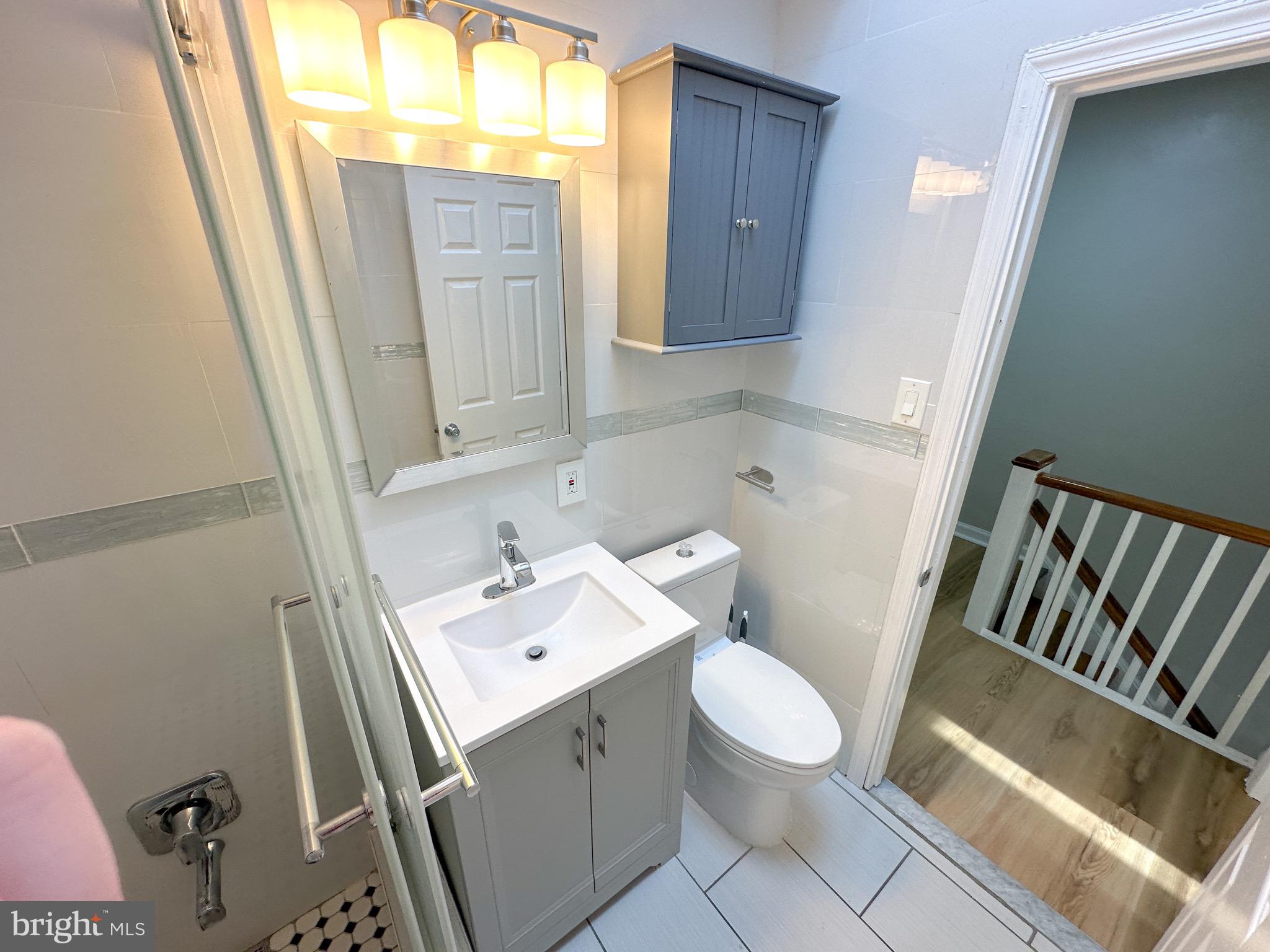 217 Stevens Street Philadelphia, PA 19111 - Photo 12 of 18 a bathroom with a sink and a toilet