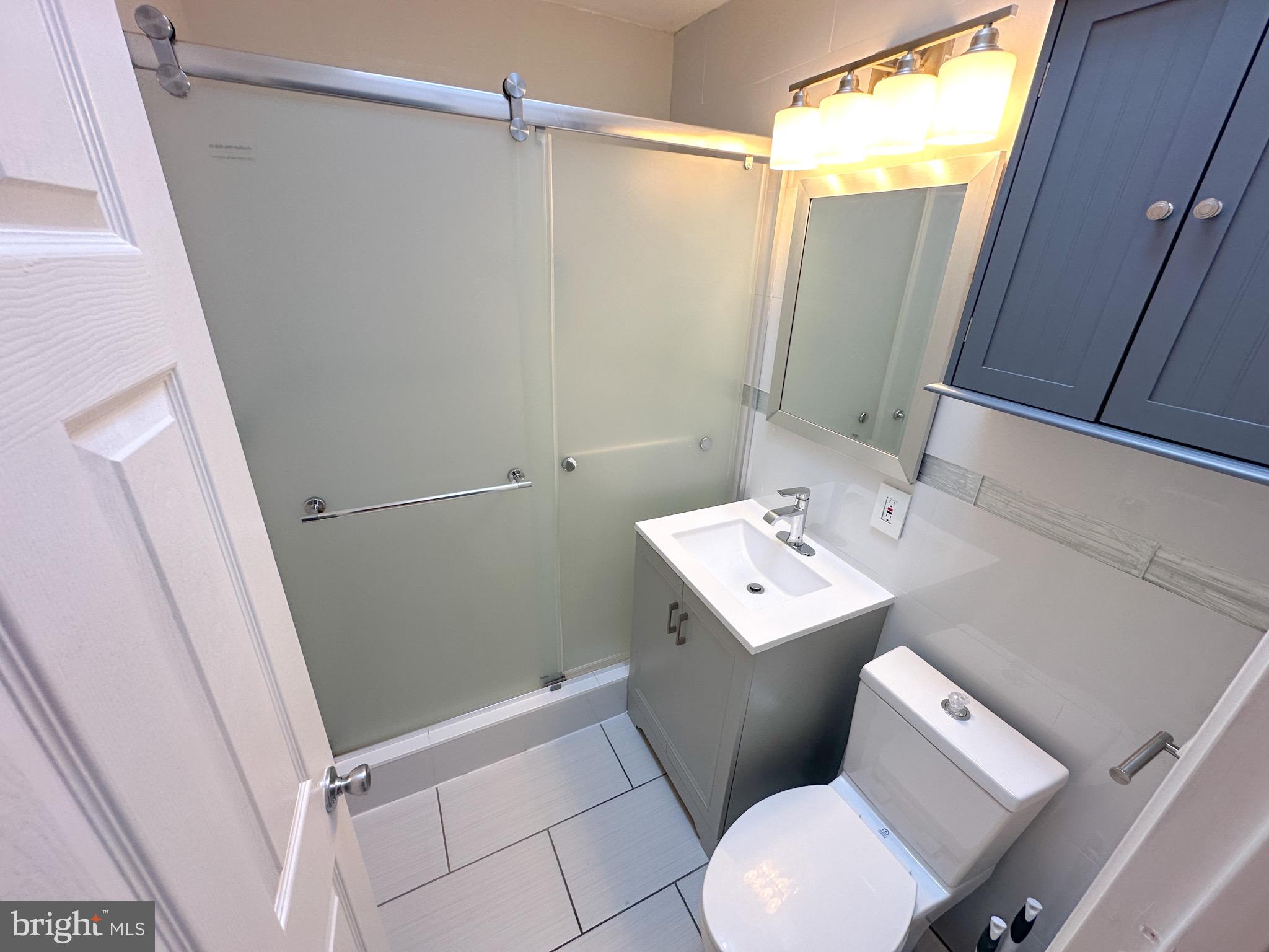 217 Stevens Street Philadelphia, PA 19111 - Photo 13 of 18 a bathroom with a sink toilet and shower