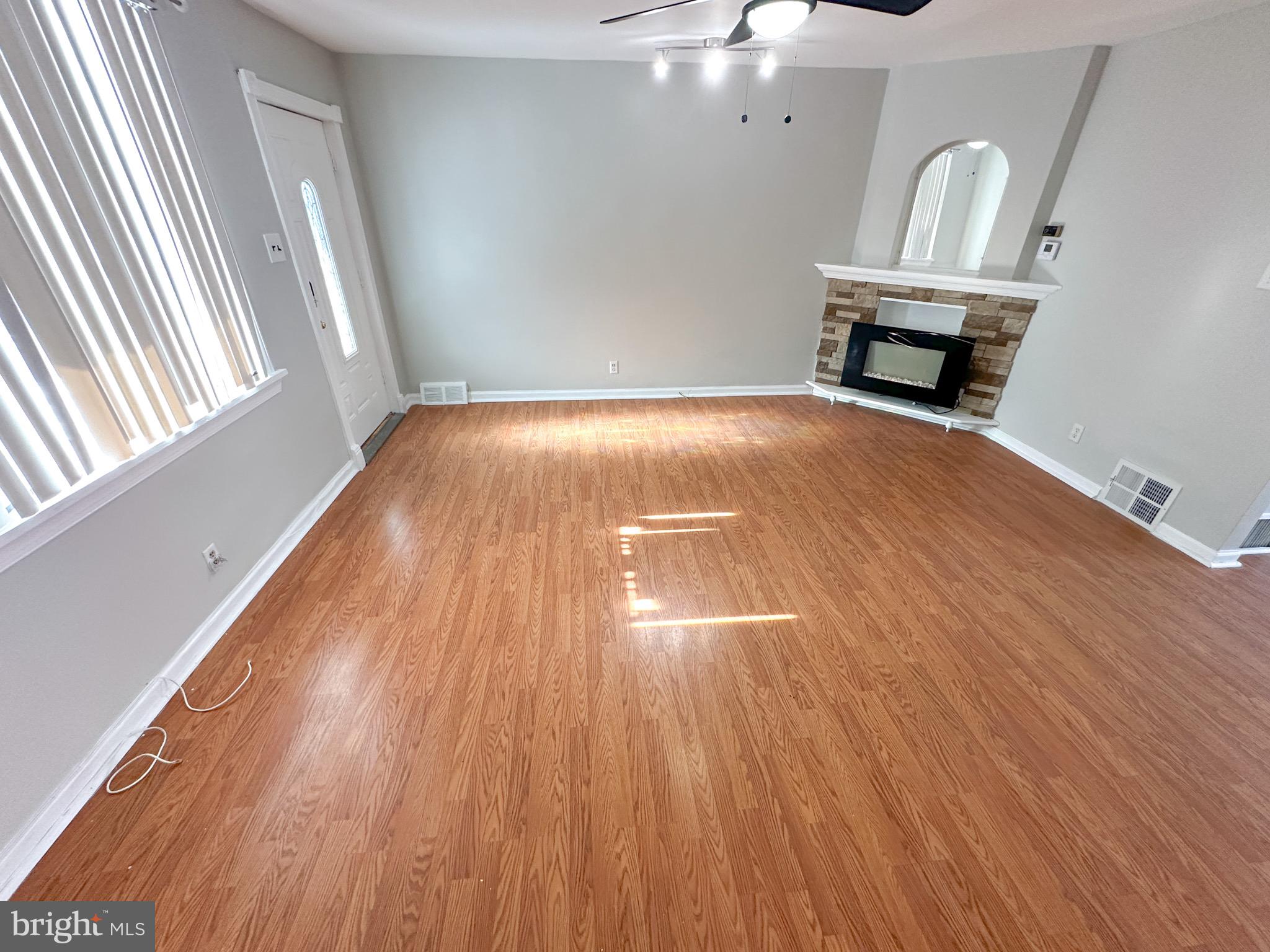 217 Stevens Street Philadelphia, PA 19111 - Photo 3 of 18 a view of empty room with wooden floor and fan