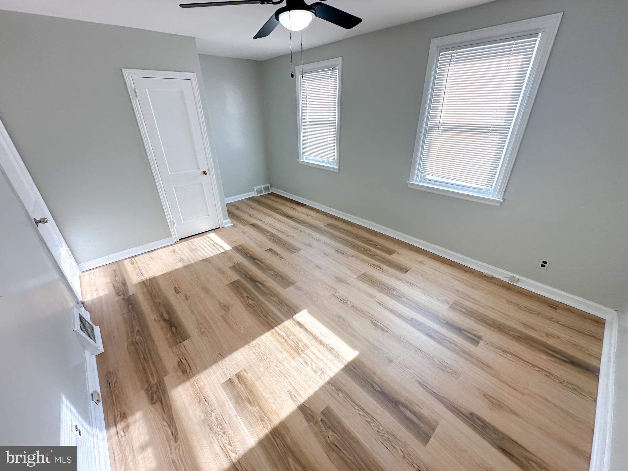 217 Stevens Street Philadelphia, PA 19111 - Photo 7 of 18 a view of wooden floor and windows in a room