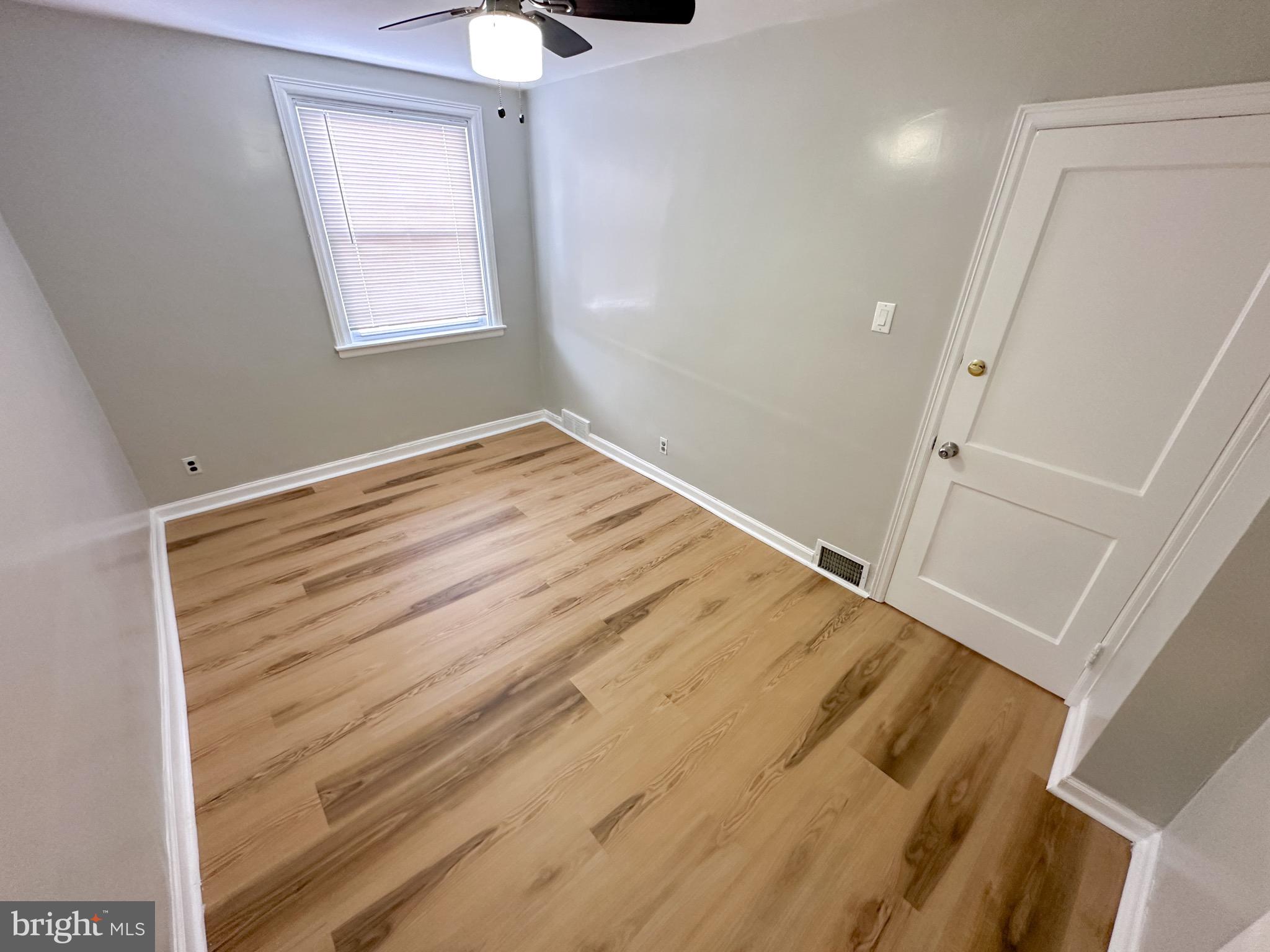 217 Stevens Street Philadelphia, PA 19111 - Photo 10 of 18 a view of empty room with wooden floor and fan