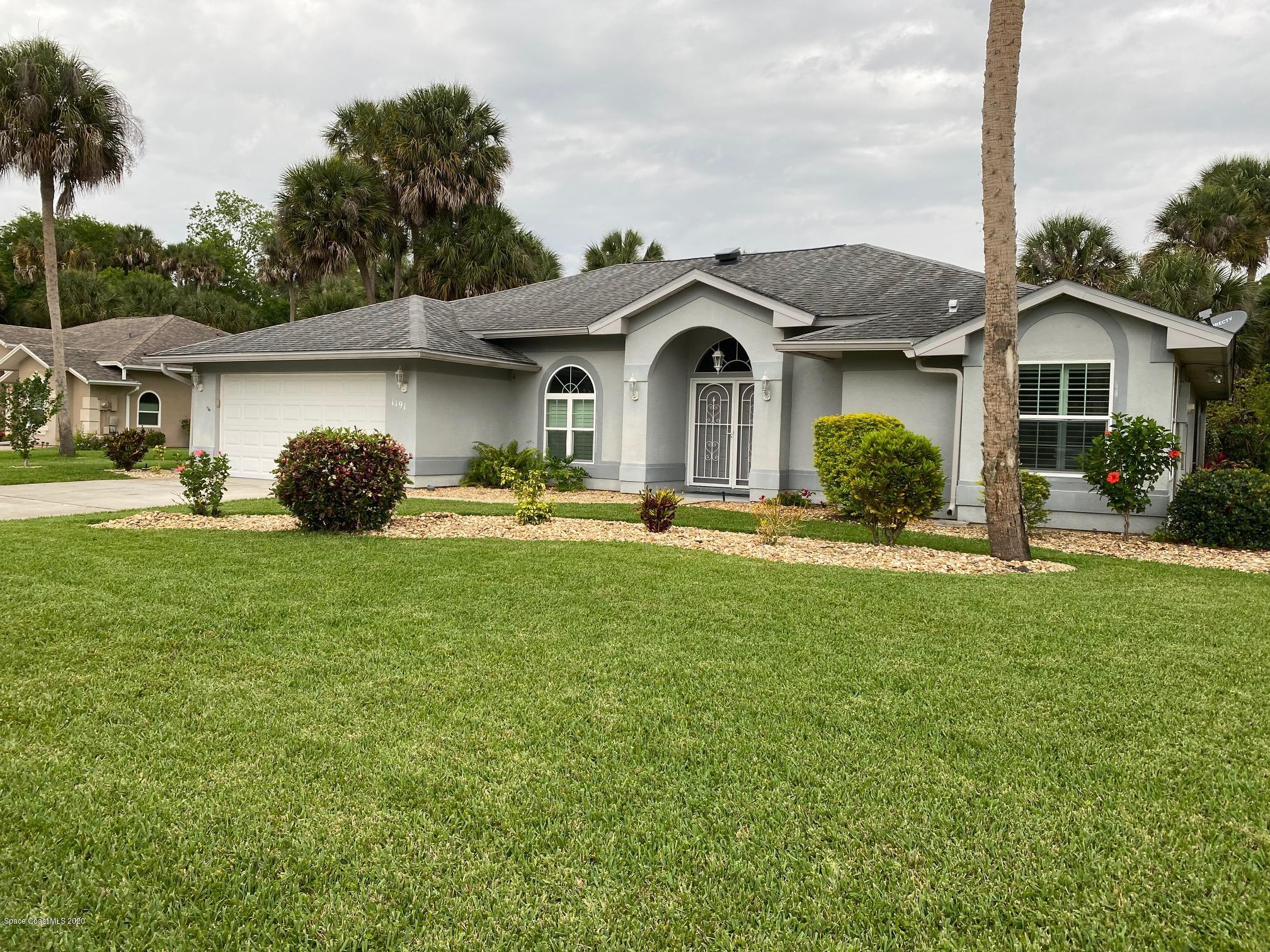 1191 Meadowbrook Road Northeast Palm Bay, FL 32905 - Photo 1 of 32 Front of Home