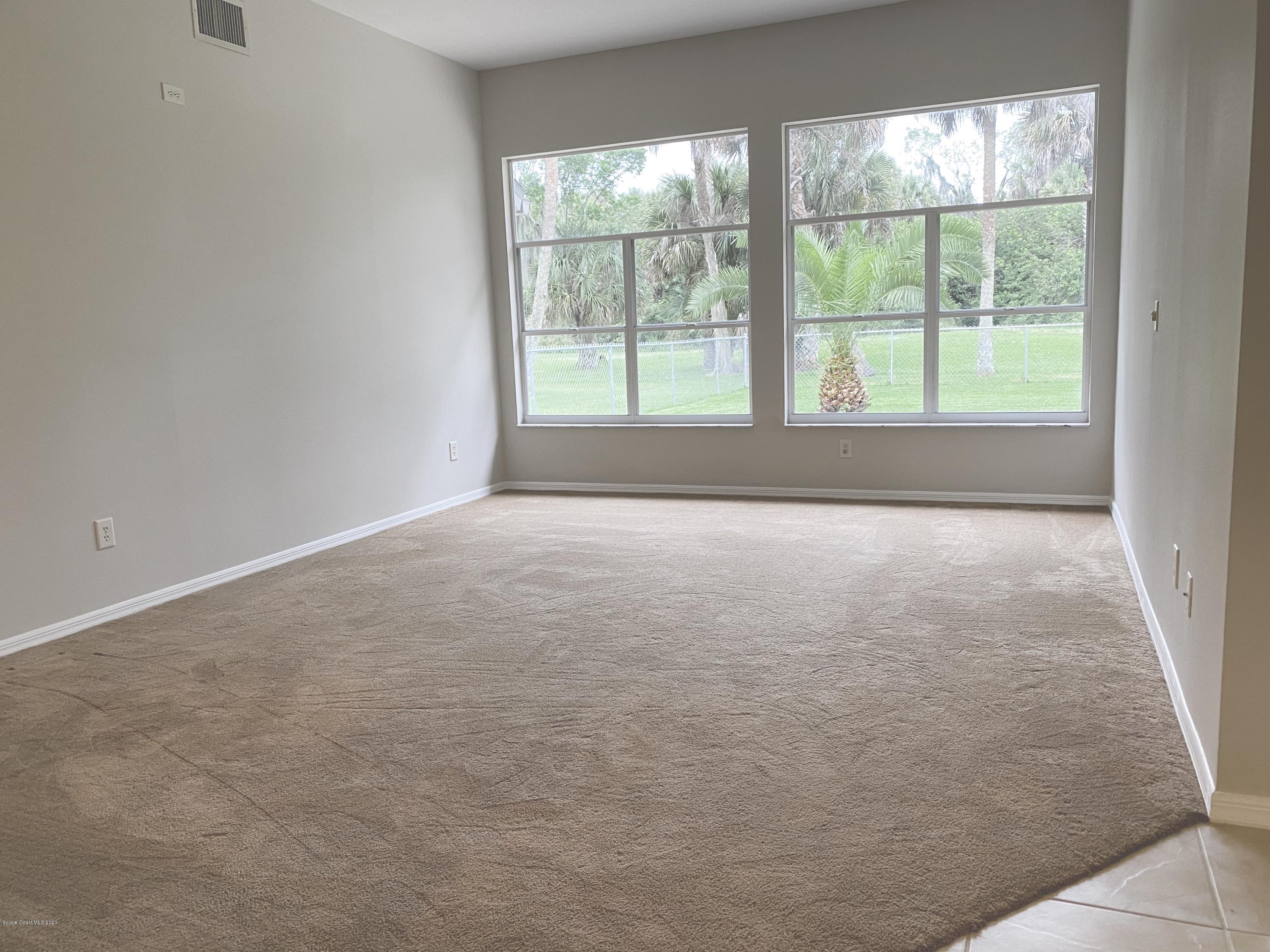 1191 Meadowbrook Road Northeast Palm Bay, FL 32905 - Photo 12 of 32 Family Room