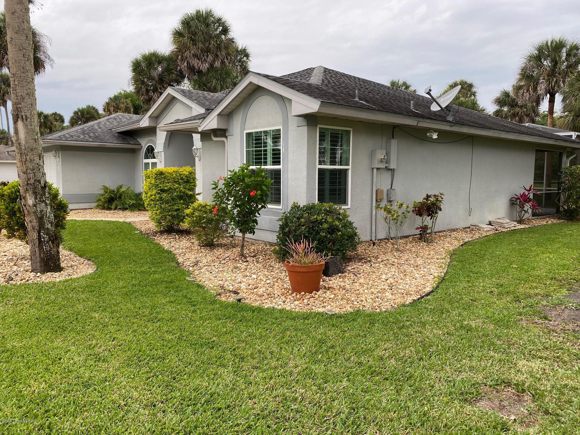 1191 Meadowbrook Road Northeast Palm Bay, FL 32905 - Photo 3 of 32 East side of Home