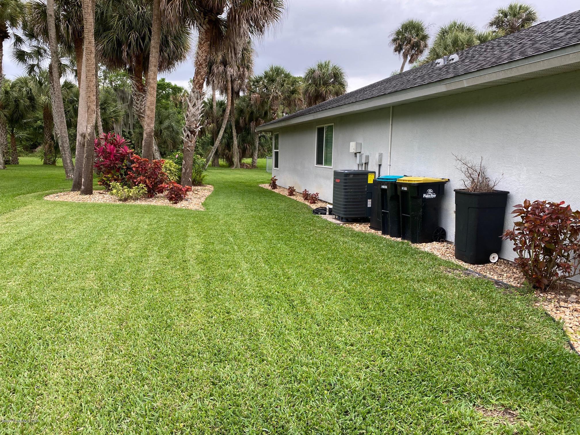 1191 Meadowbrook Road Northeast Palm Bay, FL 32905 - Photo 30 of 32 West Side of Home