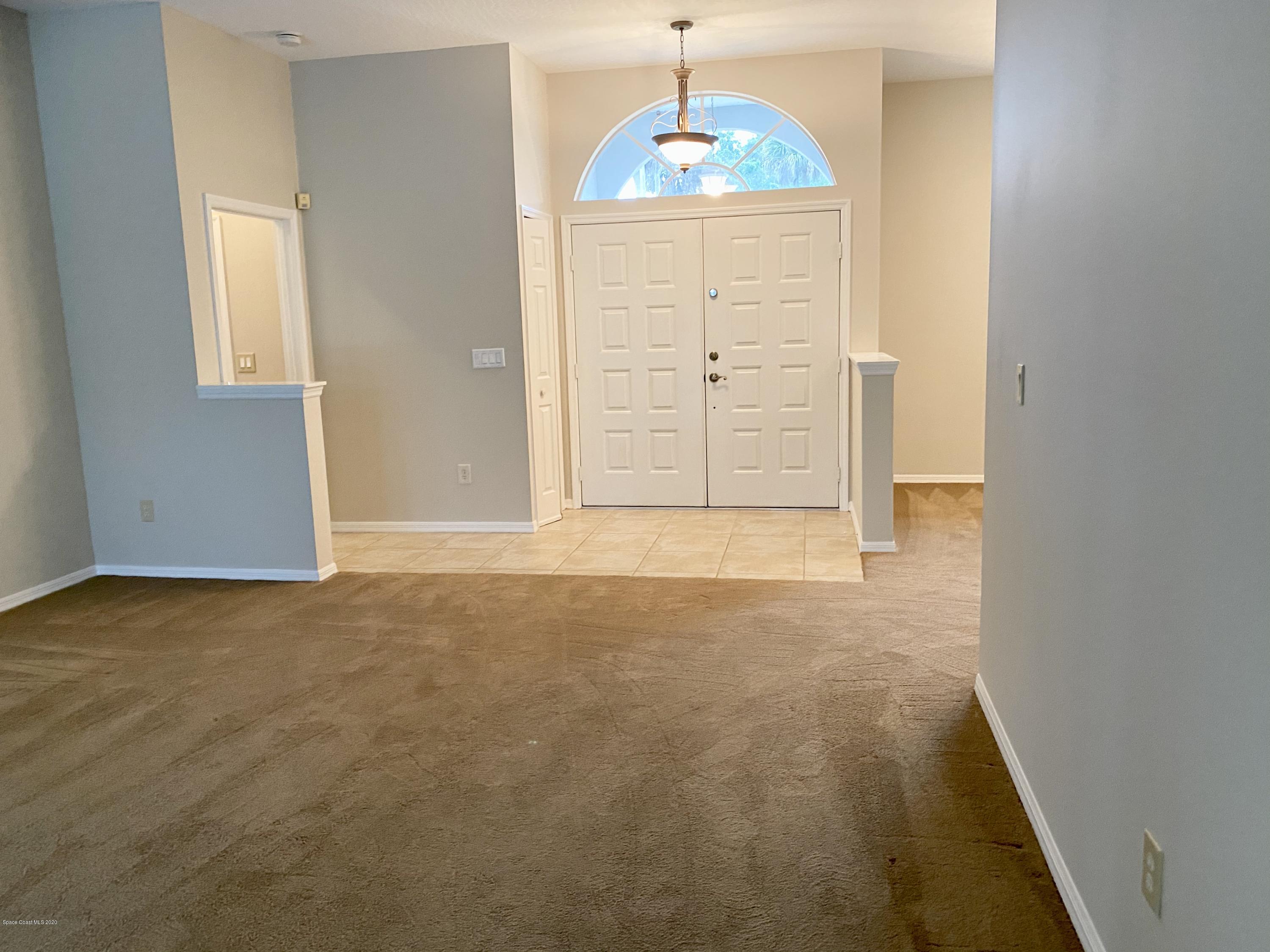 1191 Meadowbrook Road Northeast Palm Bay, FL 32905 - Photo 4 of 32 Front Entry