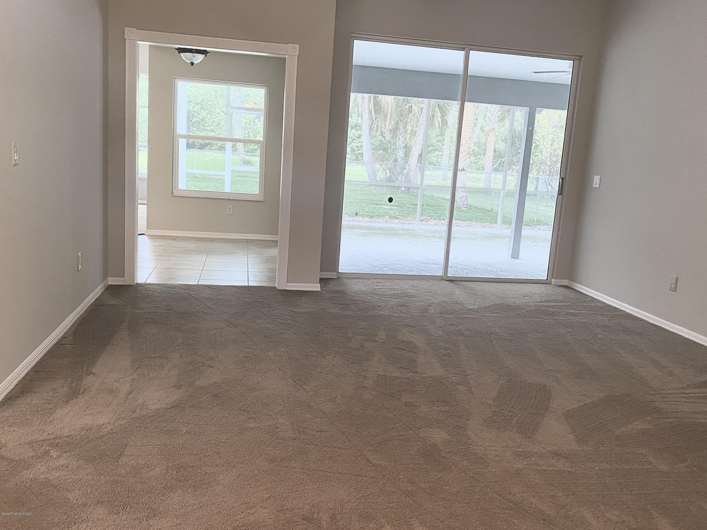 1191 Meadowbrook Road Northeast Palm Bay, FL 32905 - Photo 6 of 32 Living Room