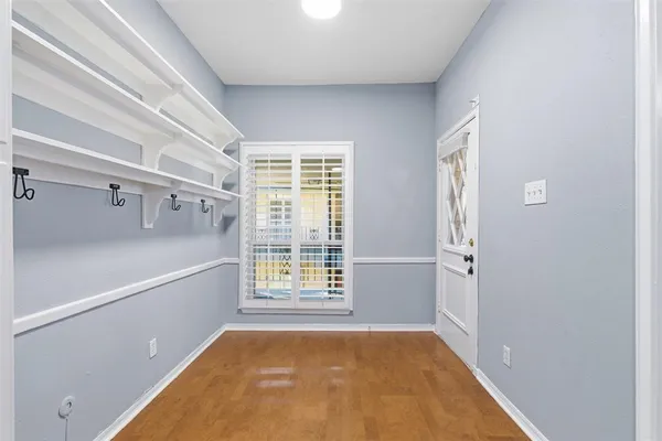 a view of an empty room with a window