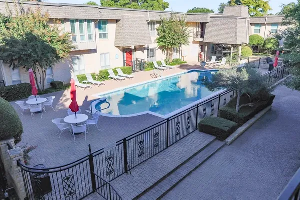 a balcony with table and chairs