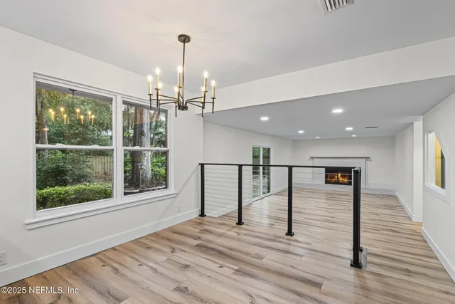 a bathroom with a granite countertop sink a large mirror and a bathtub