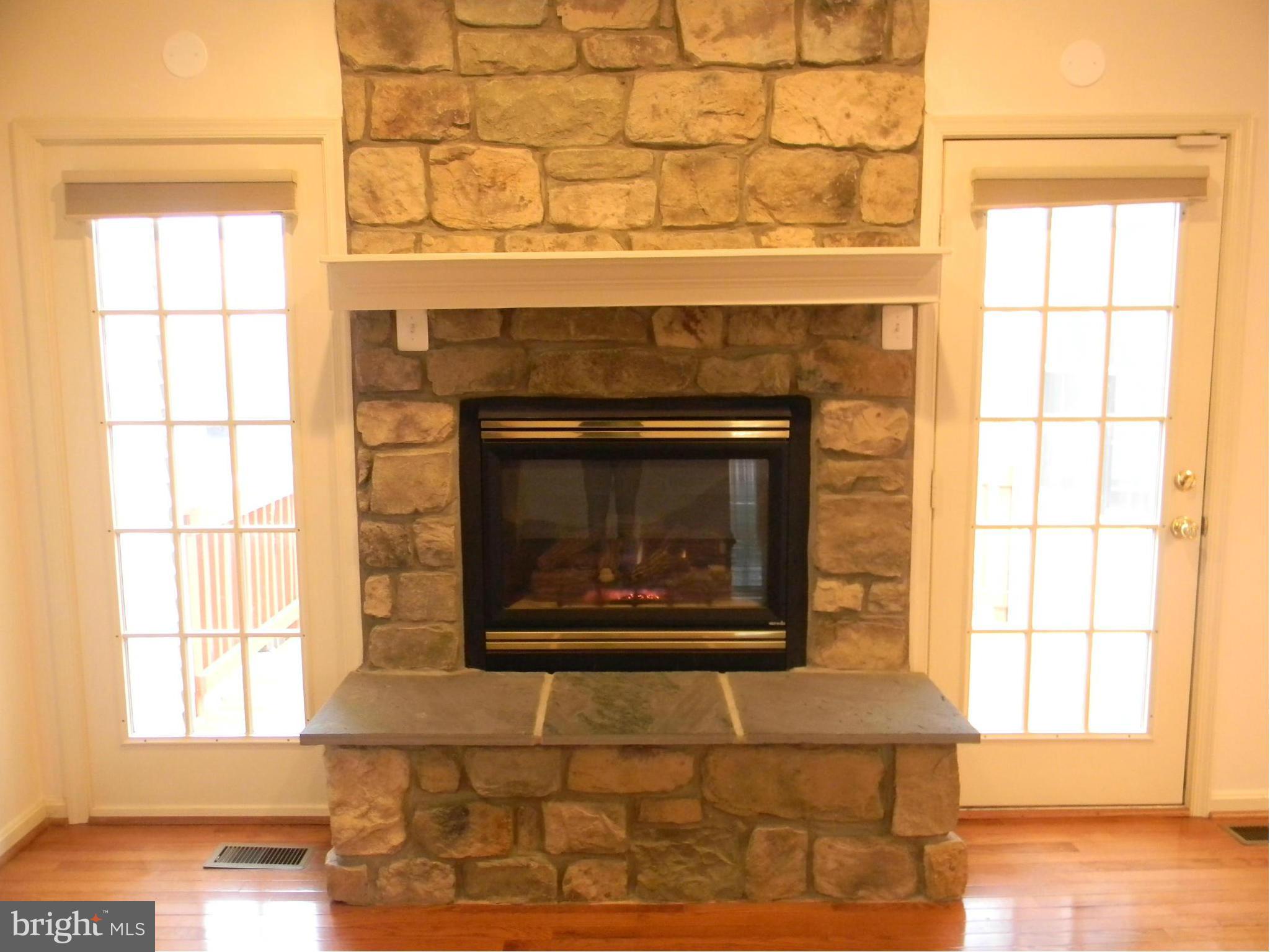 2442 Rippling Brook Road Frederick, MD 21701 - Photo 15 of 30 a fireplace with a window