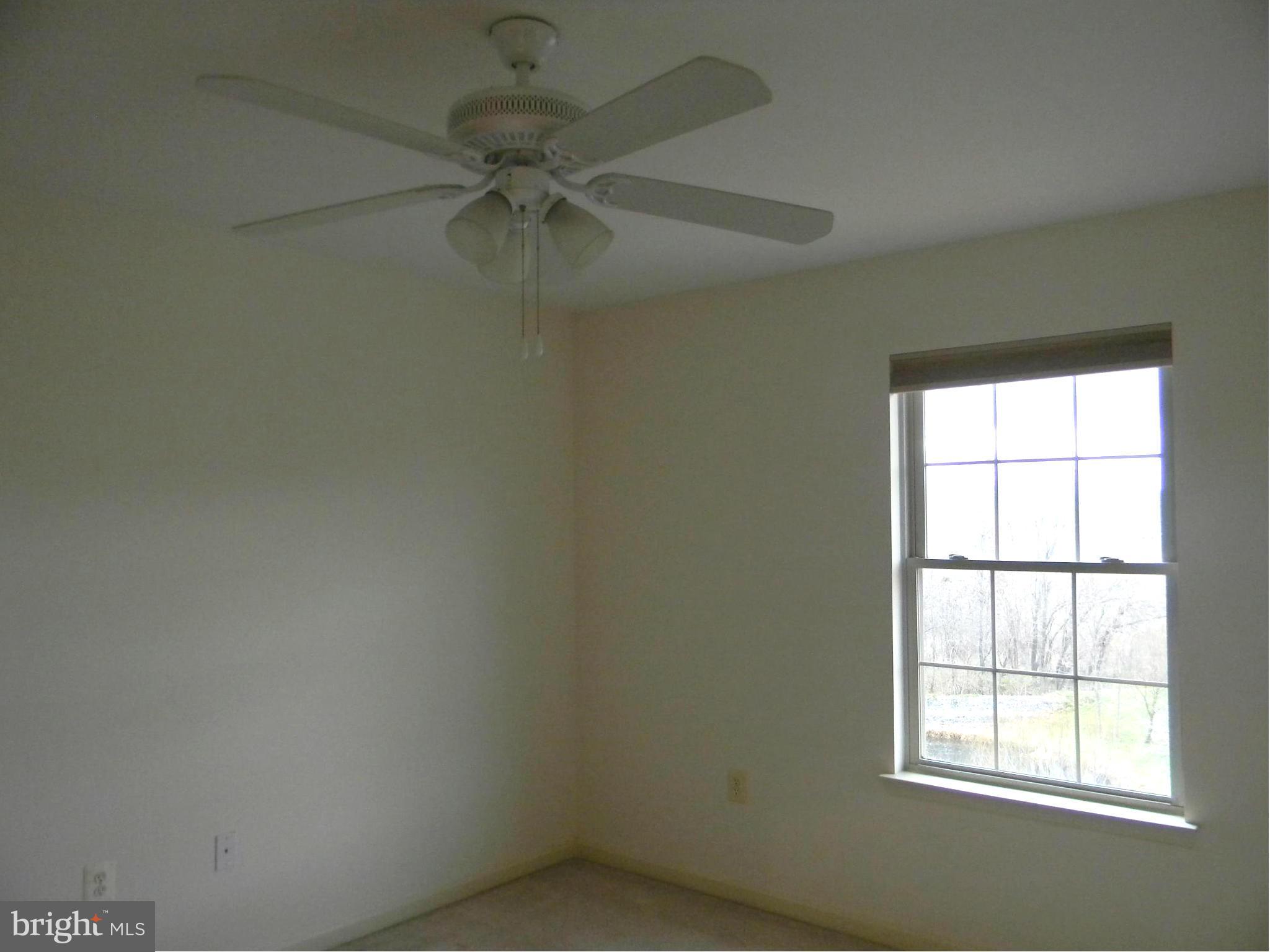 2442 Rippling Brook Road Frederick, MD 21701 - Photo 21 of 30 an empty room with a window