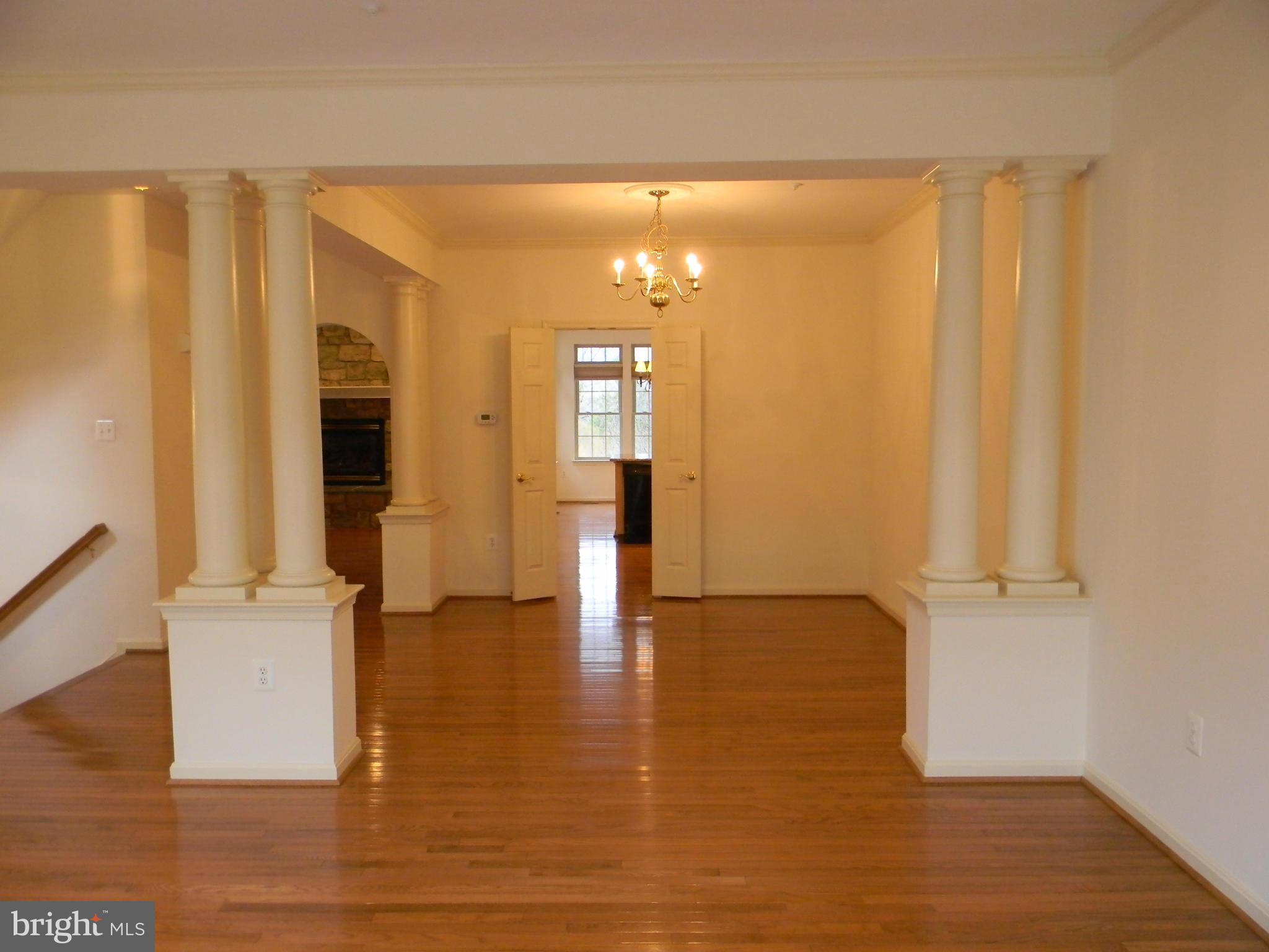 2442 Rippling Brook Road Frederick, MD 21701 - Photo 7 of 30 wooden floor in an empty room with a window