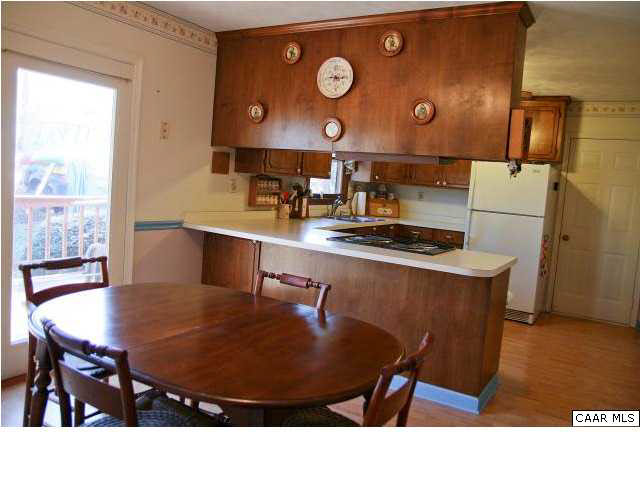 55 Amethyst Road Palmyra, VA 22963 - Photo 12 of 30 a kitchen with a table chairs and wooden floor