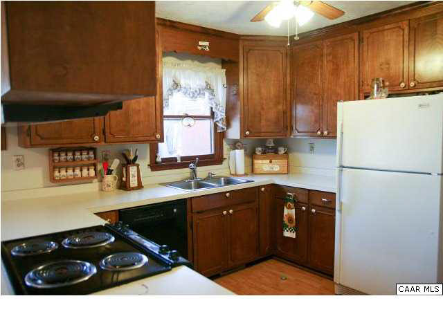 55 Amethyst Road Palmyra, VA 22963 - Photo 15 of 30 a kitchen with a sink refrigerator and cabinets