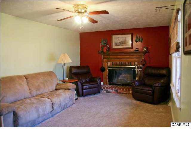 55 Amethyst Road Palmyra, VA 22963 - Photo 16 of 30 a living room with furniture and a fireplace