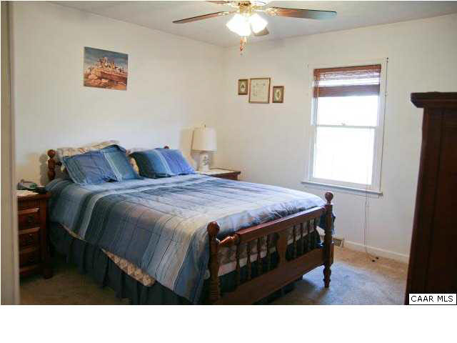55 Amethyst Road Palmyra, VA 22963 - Photo 19 of 30 a bedroom with a bed and a window
