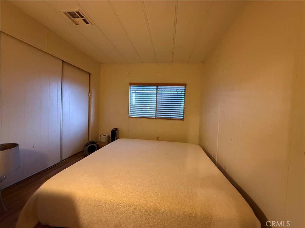 32600 State Highway 74, Unit 140 Hemet, CA 92545 - Photo 16 of 30 a bedroom with a bed and a window