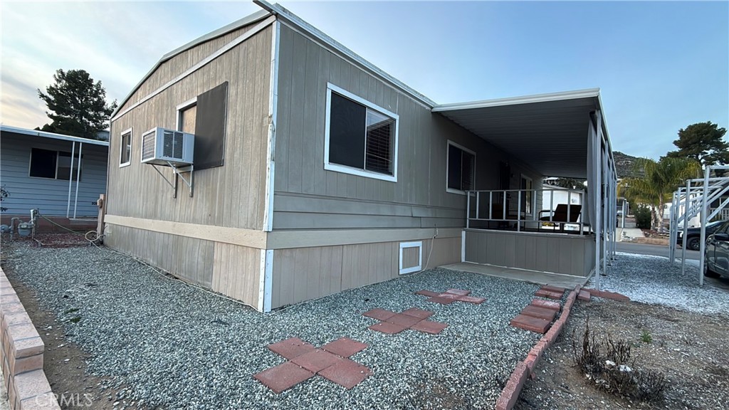 32600 State Highway 74, Unit 140 Hemet, CA 92545 - Photo 21 of 30 a view of a house with a yard